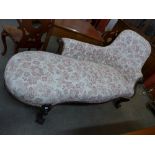 A Victorian rosewood and upholstered chaise longue