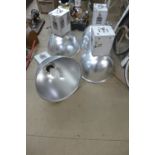 A set of four industrial hanging lights