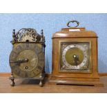 An Elliott walnut timepiece and a brass lantern clock,