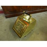 A Victorian Aesthetic Movement brass coal scuttle