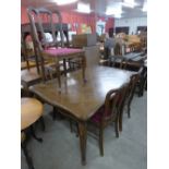 A French oak draw-leaf dining table and six chairs