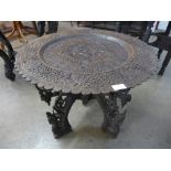 An oriental carved blackwood occasional table