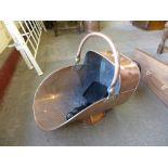 A Victorian copper coal scuttle and shovel