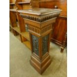 A Victorian carved oak and copper panelled pedestal