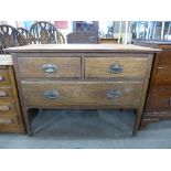An Edward VII oak chest of drawers