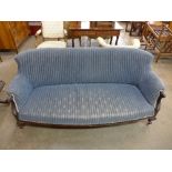 A Victorian mahogany and upholstered settee