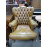 A French carved beech and leather upholstered fauteuil