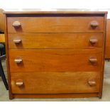 A teak chest of drawers