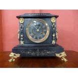 A 19th Century French Belge noir and parcel gilt mantel clock