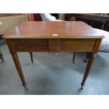 A Victorian mahogany two drawer writing table