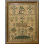 A Victorian sampler by Anne Baldwin, finished in the year 1841 aged 12 years, framed,