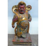 An oriental polychrome figure of a warrior