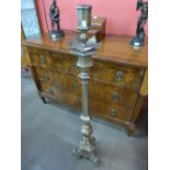 An ecclesiastical bronze candle stand