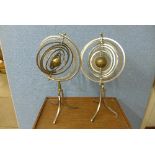 A pair of steel armillaries