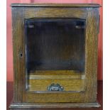 An Edward VII oak smoker's cabinet