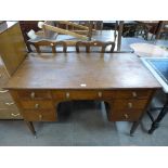 A Victorian inlaid mahogany kneehole desk