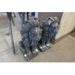 A pair of painted concrete lions