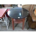 A circular marble topped pub table