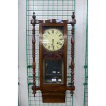 A mahogany wall clock