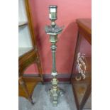 An ecclesiastical bronze candle stand
