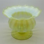 A vaseline glass pedestal vase,