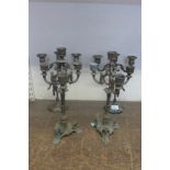 Two pairs of decorative metalwork candelabra