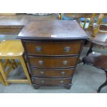 An inlaid mahogany chest of drawers