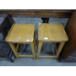 A pair of beech laboratory stools