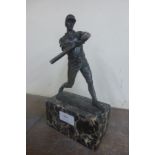 A bronze figure of a baseball player,