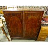 A George III inlaid mahogany bookcase (converted to a cabinet)