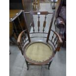 An Arts and Crafts mahogany elbow chair, manner of E.W.