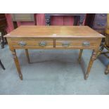 A Victorian pitch pine two drawer serving table
