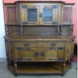 An Arts and Crafts oak buffet sideboard