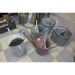 Three galvanised watering cans and four buckets