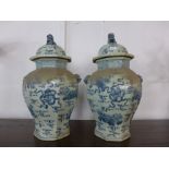 A pair of Chinese blue and white octagonal ginger jars and covers