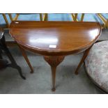 A mahogany demi-lune hall table