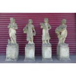 A set of four concrete garden figures,