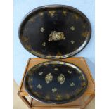 A pair of graduated Victorian lacquered metal oval trays