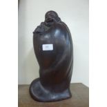 An oriental carved hardwood Buddha