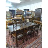 A French x-frame oak refectory table and eight chairs