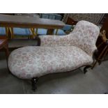 A Victorian rosewood and upholstered chaise longue