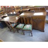 A carved oak six piece dining suite