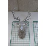 A silvered stag's head