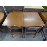 A teak dining table and four chairs