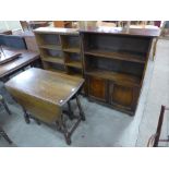 Two oak open bookcases and a drop-leaf table