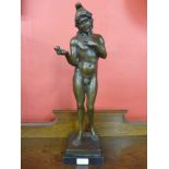 A French style bronze figure of a male nude holding an apple,