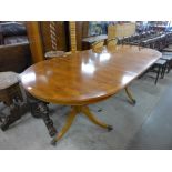 A Regency style yew wood twin pillar dining table