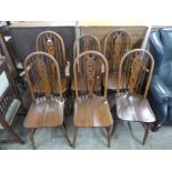 A set of six beech wheelback kitchen chairs