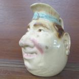 A Sarreguemines majolica glaze grotesque mask character jug, marked 3181, height to the 'spout' 21.