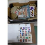 A box of stamp albums and loose stamps